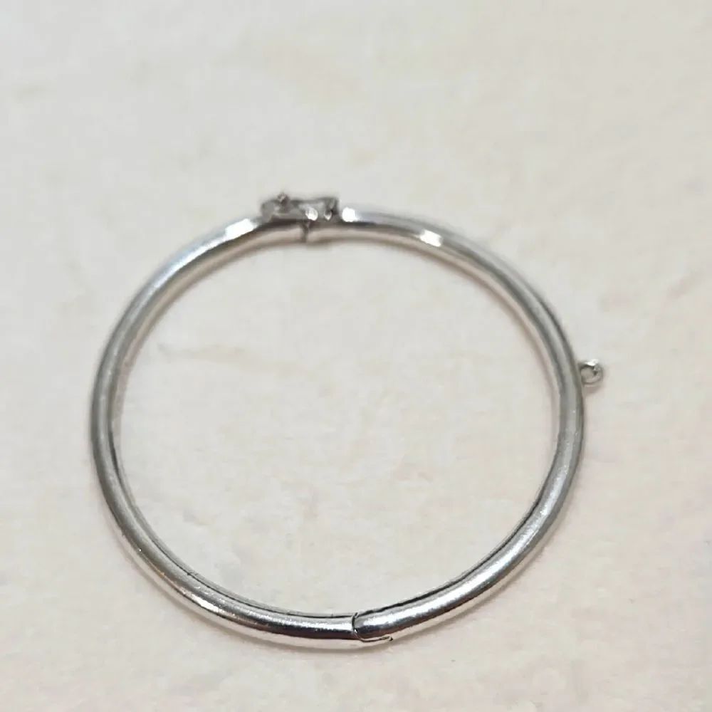 Kate Spade New York hinged silver bangle bracelet